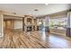 Hardwood floors and sliding glass doors to the back yard fill this living room with charm at 2776 White Sage Dr, Henderson, NV 89052