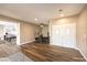 Open-concept living room with luxury vinyl flooring and a view into the dining area and kitchen at 2776 White Sage Dr, Henderson, NV 89052