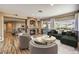 Spacious living room with fireplace, hardwood floors, outdoor access, and designer staging at 2776 White Sage Dr, Henderson, NV 89052