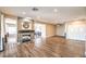 Large living room showcasing wood flooring, fireplace, open layout, and natural light at 2776 White Sage Dr, Henderson, NV 89052