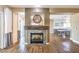 Beautiful fireplace with hardwood floors and great sightlines in the main living area at 2776 White Sage Dr, Henderson, NV 89052