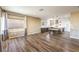 Open living room flows into the kitchen with lots of natural light and wood flooring at 2776 White Sage Dr, Henderson, NV 89052
