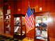 Detailed display cases and military memorabilia adorn the paneled walls of the memorial hall at 2776 White Sage Dr, Henderson, NV 89052
