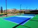 Well-maintained pickleball court with blue and green surface, perfect for friendly matches and outdoor enjoyment at 2776 White Sage Dr, Henderson, NV 89052