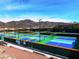 Multiple colorful pickleball courts offer a great recreational activity with mountain views in the background at 2776 White Sage Dr, Henderson, NV 89052