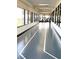 Bright and airy indoor running track with floor to ceiling windows and access to treadmills at 2776 White Sage Dr, Henderson, NV 89052