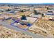 Aerial view of a property with a house, a large yard, and desert surroundings, highlighted with a blue border at 2831 Goldrush St, Pahrump, NV 89048