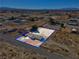 Wide aerial view of a home with a large lot in a desert area, outlined in blue for property boundaries at 2831 Goldrush St, Pahrump, NV 89048