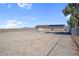 Large desert backyard with gravel landscaping, a home equipped with solar panels, perfect for various activities at 2831 Goldrush St, Pahrump, NV 89048