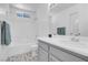 Clean bathroom featuring a neutral vanity, shower-tub combo and tile floors at 2831 Goldrush St, Pahrump, NV 89048