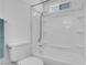 Bright white bathroom with a shower-tub combo and updated fixtures at 2831 Goldrush St, Pahrump, NV 89048