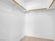 Walk in closet with white walls and minimal shelving rods at 2831 Goldrush St, Pahrump, NV 89048