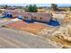 Single-story home featuring a large gravel yard and a fenced-in area at 2831 Goldrush St, Pahrump, NV 89048