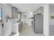 Well-lit kitchen features stainless steel appliances, white countertops and grey cabinets at 2831 Goldrush St, Pahrump, NV 89048
