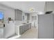 Well-lit kitchen features stainless steel appliances, white countertops and grey cabinets at 2831 Goldrush St, Pahrump, NV 89048