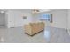 Spacious living room with a ceiling fan and tile flooring at 2831 Goldrush St, Pahrump, NV 89048