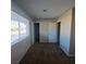 Bedroom with neutral colored carpet and paint, and lots of light from large window at 3417 Civic Center Dr # B, North Las Vegas, NV 89030
