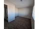Cozy bedroom includes neutral carpet and access to laundry at 3417 Civic Center Dr # B, North Las Vegas, NV 89030