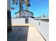 Fenced backyard with a concrete patio, desert landscaping, and some shade at 3523 Mercury St # A, North Las Vegas, NV 89030