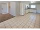 Bright kitchen featuring white cabinets, granite countertops, and modern appliances at 3523 Mercury St # A, North Las Vegas, NV 89030