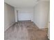Bedroom with carpet, gray walls, and built in closet at 3523 Mercury St # G, North Las Vegas, NV 89030