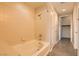 Bright bathroom features a tub and shower combination with a neutral-toned tile surround at 353 E Bonneville Ave # 439, Las Vegas, NV 89101