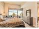 Comfortable bedroom features a large window with city views and stylish furnishings at 353 E Bonneville Ave # 439, Las Vegas, NV 89101