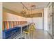 Stylish dining area featuring a colorful banquet, modern gold chairs, decorative lighting, and stainless steel tables at 353 E Bonneville Ave # 439, Las Vegas, NV 89101