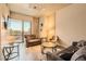 Bright living room with comfortable sofas, a balcony with a view, and minimalist decor at 353 E Bonneville Ave # 439, Las Vegas, NV 89101