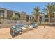 Outdoor patio area with seating and a fire pit, perfect for entertaining and relaxing at 353 E Bonneville Ave # 439, Las Vegas, NV 89101