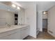Bathroom featuring double sinks, modern fixtures, and a combo washer/dryer at 353 E Bonneville Ave # 904, Las Vegas, NV 89101