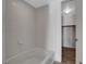 Bright bathroom featuring a modern bathtub with tile surround at 353 E Bonneville Ave # 904, Las Vegas, NV 89101