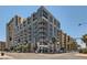 Modern condominium exterior featuring large windows and sleek architectural design in an urban setting at 353 E Bonneville Ave # 904, Las Vegas, NV 89101