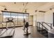 Well-lit gym with treadmill and exercise bike, offering stunning city views at 353 E Bonneville Ave # 904, Las Vegas, NV 89101