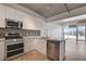 Modern kitchen featuring white cabinets, stainless steel appliances, and granite countertops at 353 E Bonneville Ave # 904, Las Vegas, NV 89101