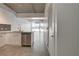 Bright modern kitchen with stainless steel dishwasher, sleek cabinets, and tiled floors at 353 E Bonneville Ave # 904, Las Vegas, NV 89101