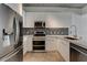 Modern kitchen featuring stainless steel appliances, white cabinets, and a stylish backsplash at 353 E Bonneville Ave # 904, Las Vegas, NV 89101