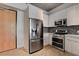 Contemporary kitchen showcasing stainless steel appliances and white cabinetry at 353 E Bonneville Ave # 904, Las Vegas, NV 89101