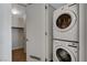 Laundry area featuring a stacked washer and dryer, and access to the walk-in closet at 353 E Bonneville Ave # 904, Las Vegas, NV 89101