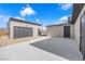 A spacious backyard featuring a detached garage and a gray exterior that offers plenty of room for outdoor activities at 364 Upland Blvd, Las Vegas, NV 89107