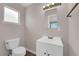 Bathroom features a single vanity, modern lighting, and laminate floors at 364 Upland Blvd, Las Vegas, NV 89107