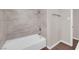 Updated bathroom with tiled shower and tub combination and updated fixtures at 364 Upland Blvd, Las Vegas, NV 89107
