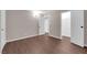 An airy bedroom with wood floors, a walk-in closet, and white trim for a clean and comfortable living space at 364 Upland Blvd, Las Vegas, NV 89107