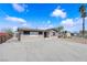 Single story home featuring a low brick facade, neutral colors, and mature trees at 364 Upland Blvd, Las Vegas, NV 89107