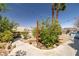 Landscaped backyard featuring a grill, plants, and a walkway at 388 Coronado Dr, Henderson, NV 89015