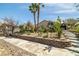 Picture of a landscaped backyard featuring garden beds, mature trees, and a spacious area for outdoor enjoyment at 388 Coronado Dr, Henderson, NV 89015