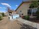 Backyard featuring a hot tub and desert landscaping under a bright blue sky, enhancing outdoor living at 388 Coronado Dr, Henderson, NV 89015