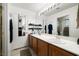 Well-lit bathroom featuring double sinks, a large mirror, and modern fixtures at 388 Coronado Dr, Henderson, NV 89015