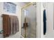 Bright bathroom features a tiled shower stall with glass doors and decorative window at 388 Coronado Dr, Henderson, NV 89015
