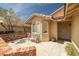 A covered front porch with a bench and a tile-roofed overhang provides shade to the entrance at 388 Coronado Dr, Henderson, NV 89015